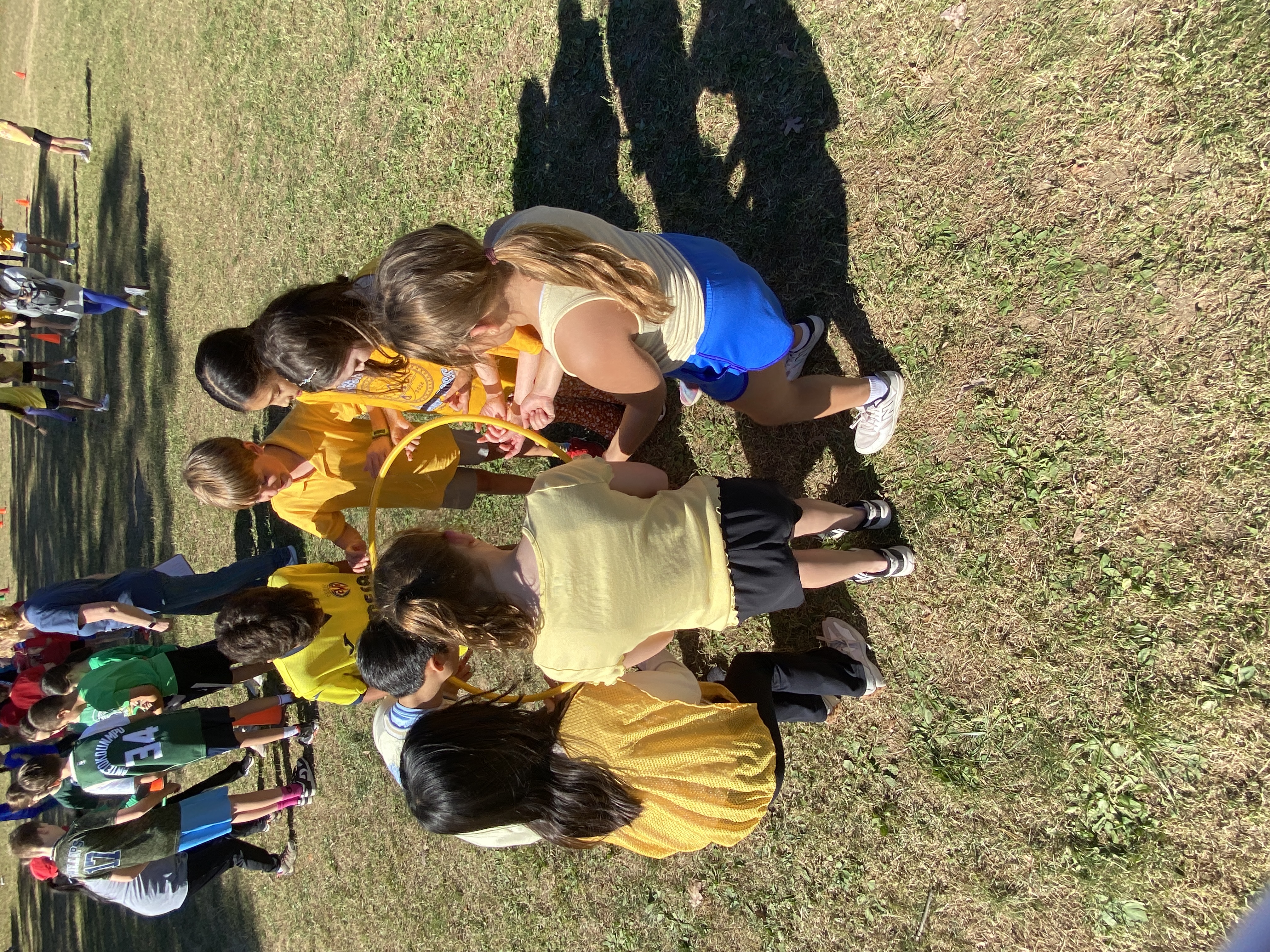 Students using teamwork during field day.