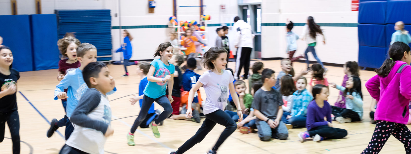 students running in gym